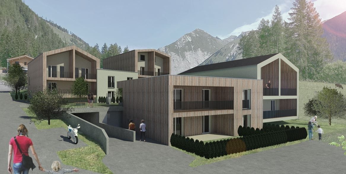 Moderne Mehrfamilienhäuser mit Holzfassaden, eingebettet in eine bergige Landschaft, in der die Menschen den Außenbereich genießen.